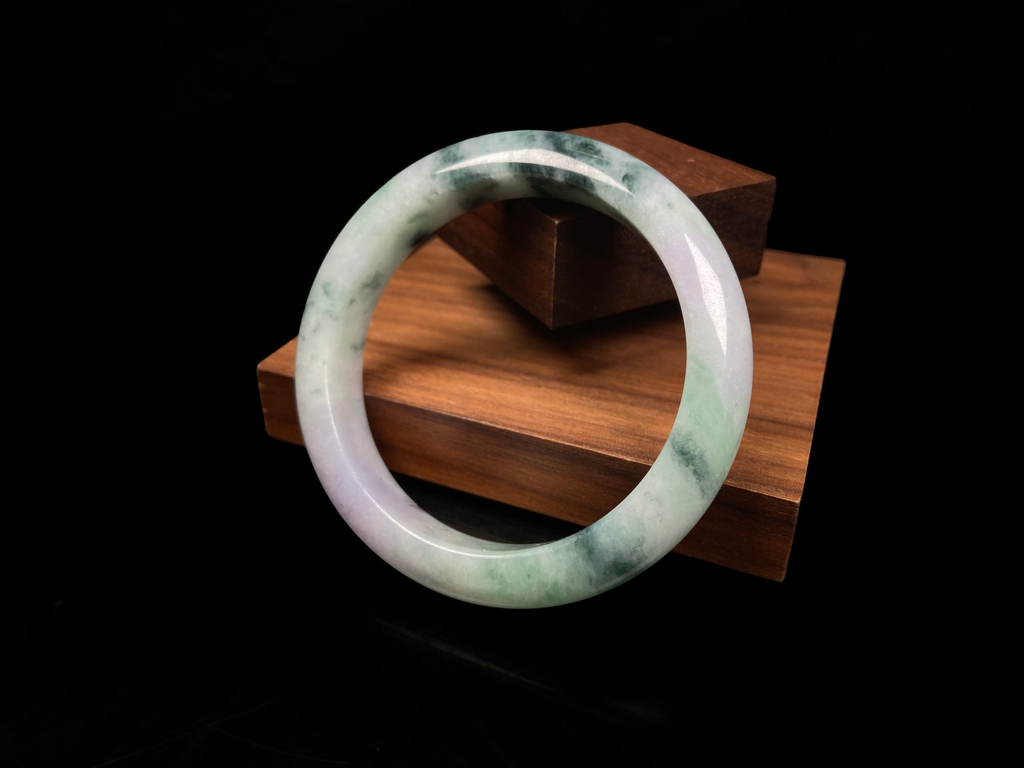 A misty green lavender jadeite bangle.