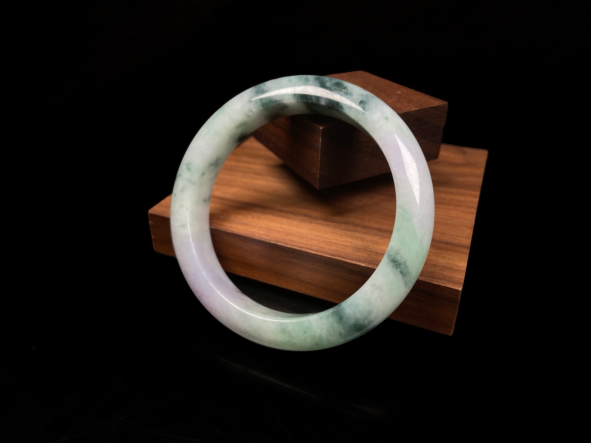 A misty green lavender jadeite bangle.