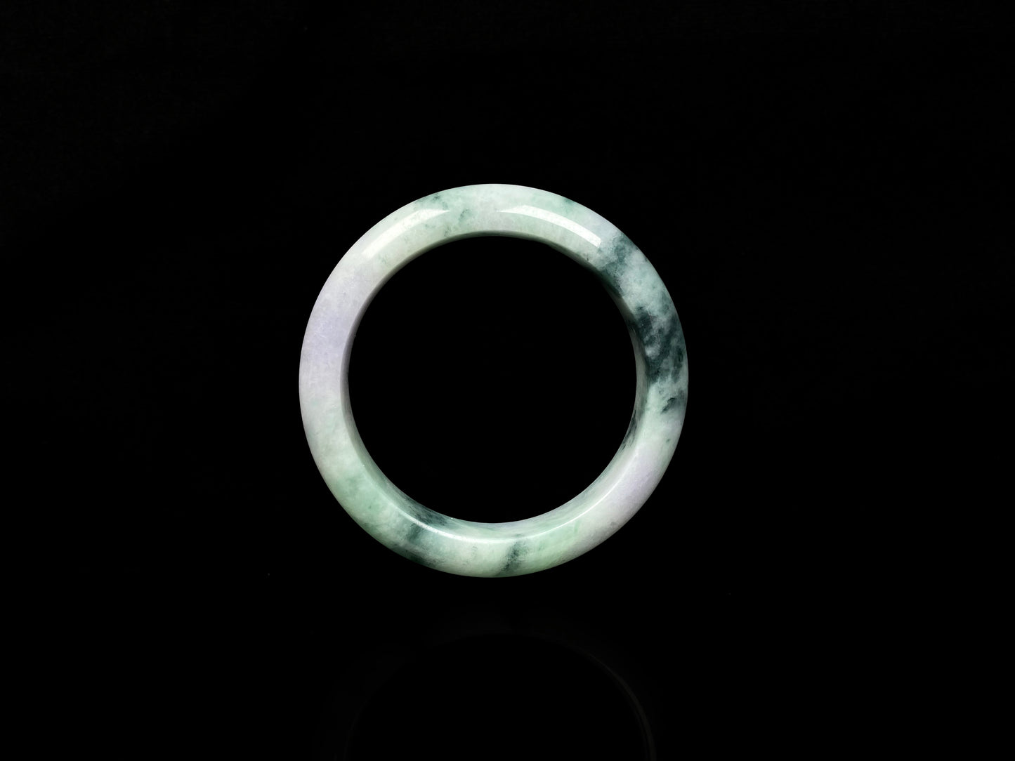A misty green lavender jadeite bangle.