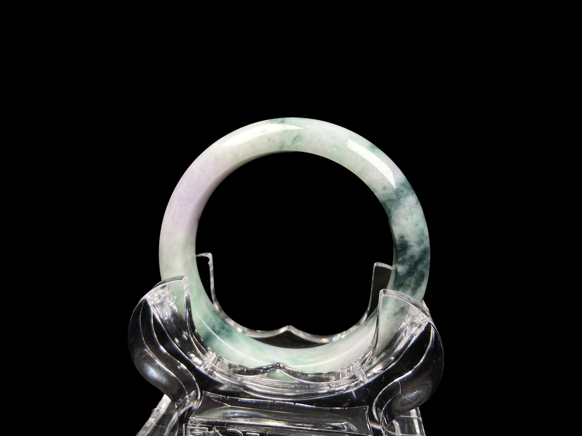 A misty green lavender jadeite bangle.