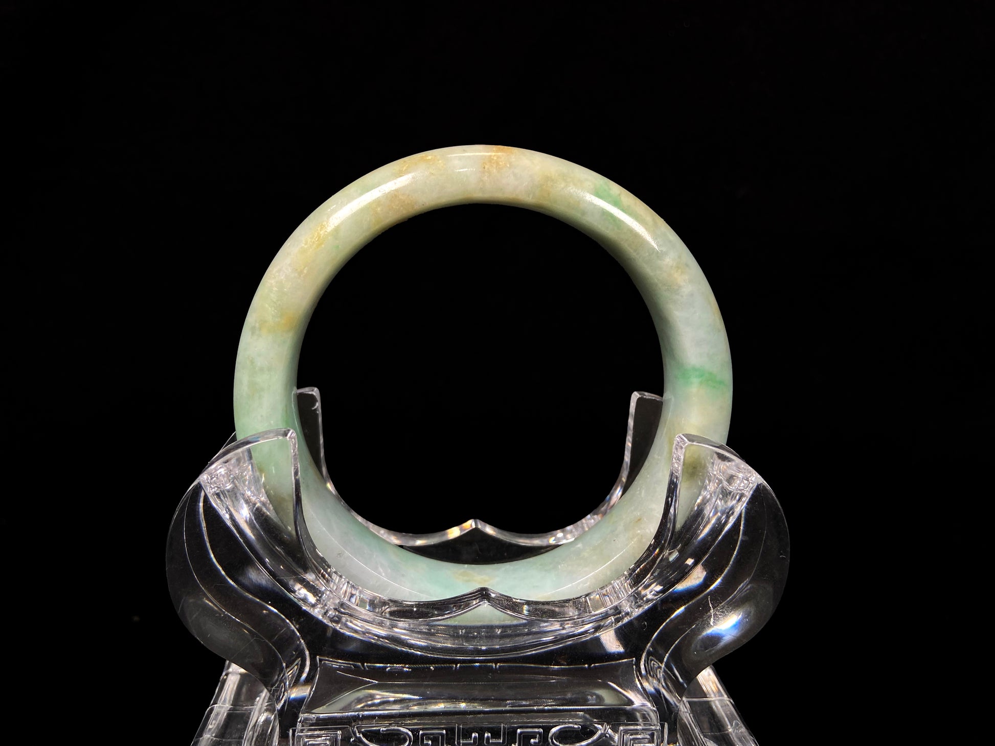 A moss honey jadeite bangle.