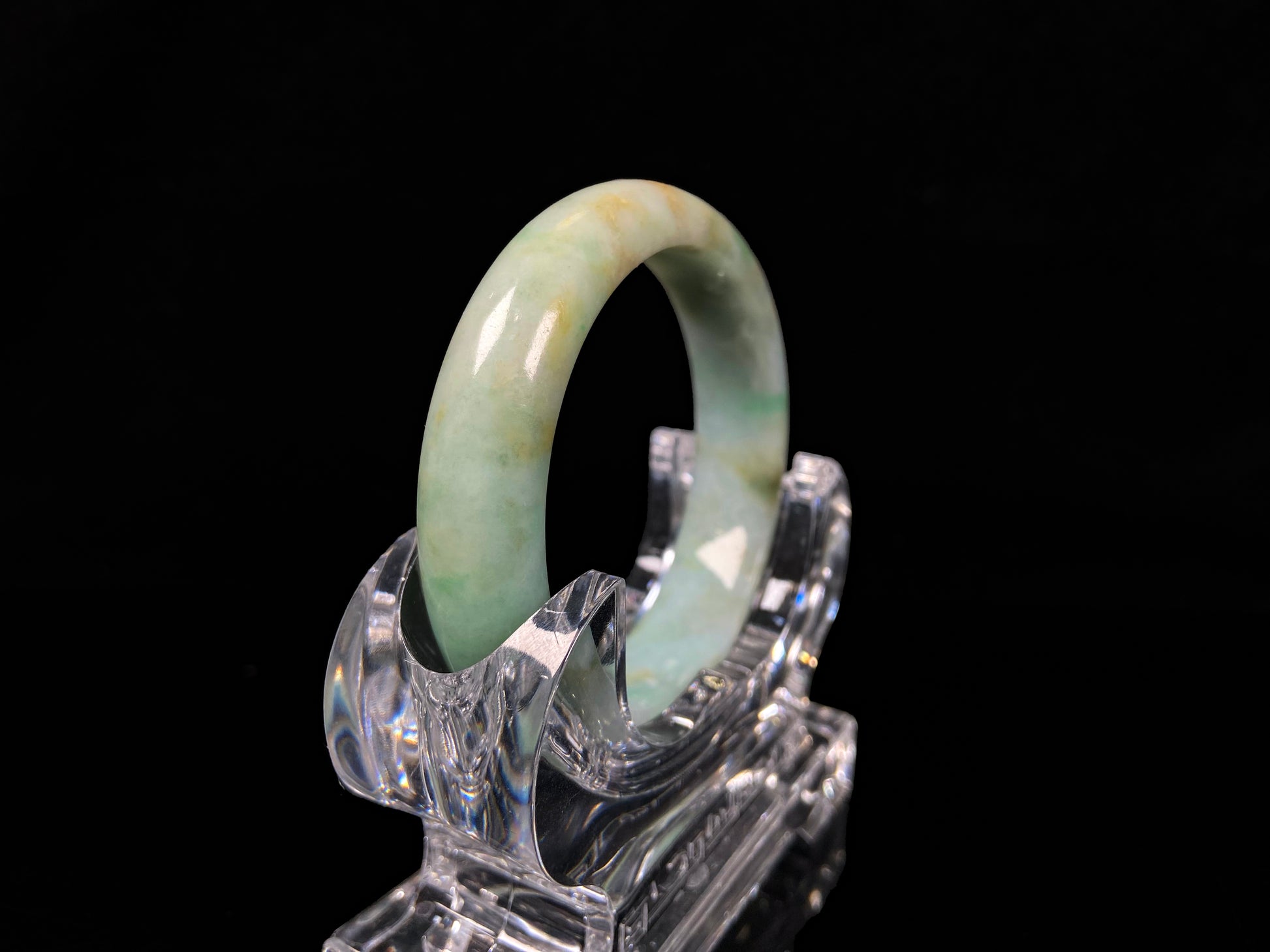 A moss honey jadeite bangle.