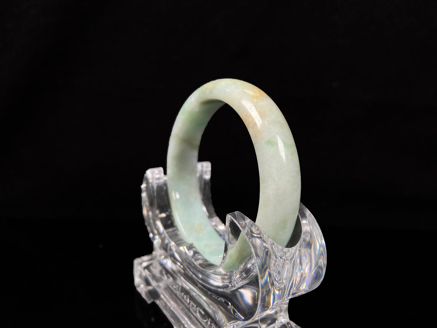 A moss honey jadeite bangle.