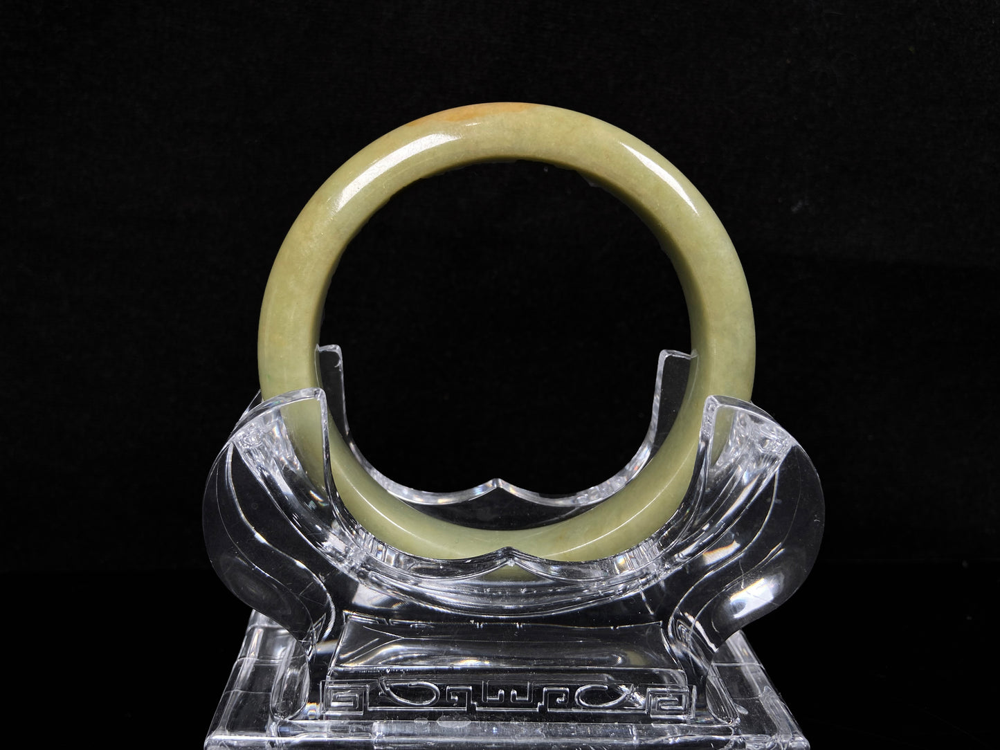 A golden lime jadeite bangle.