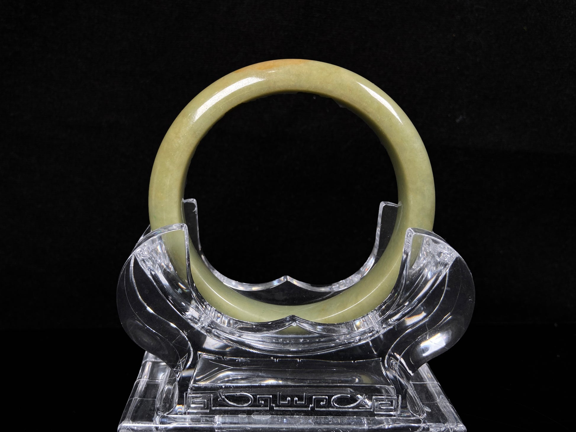 A golden lime jadeite bangle.