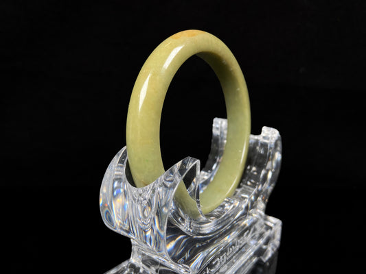 A golden lime jadeite bangle.