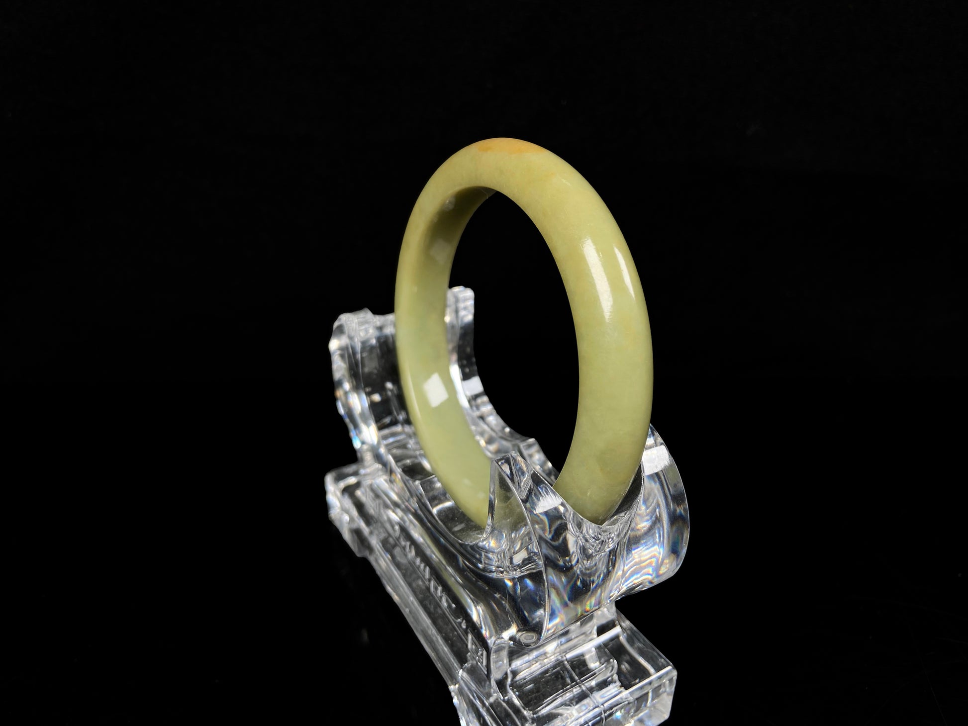 A golden lime jadeite bangle.