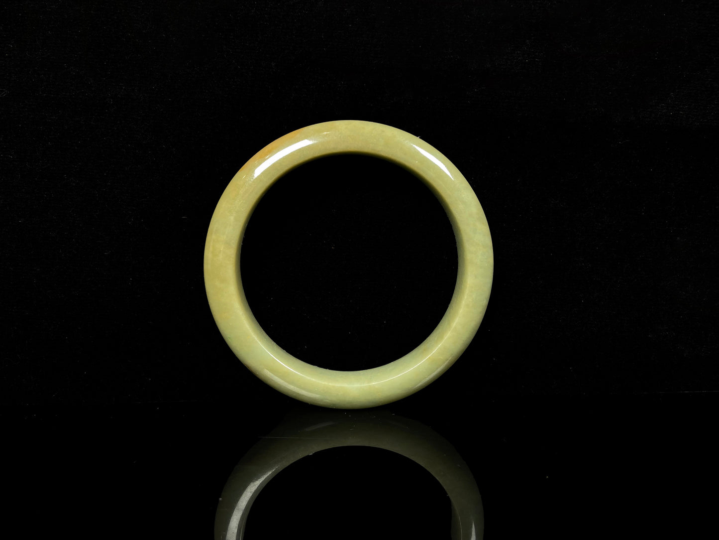 A golden lime jadeite bangle.