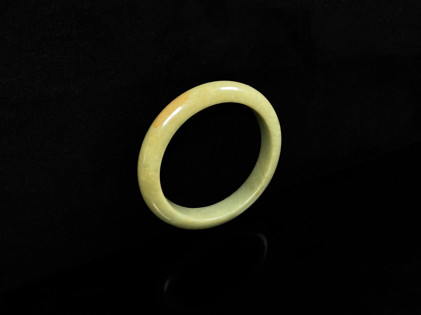 A golden lime jadeite bangle.