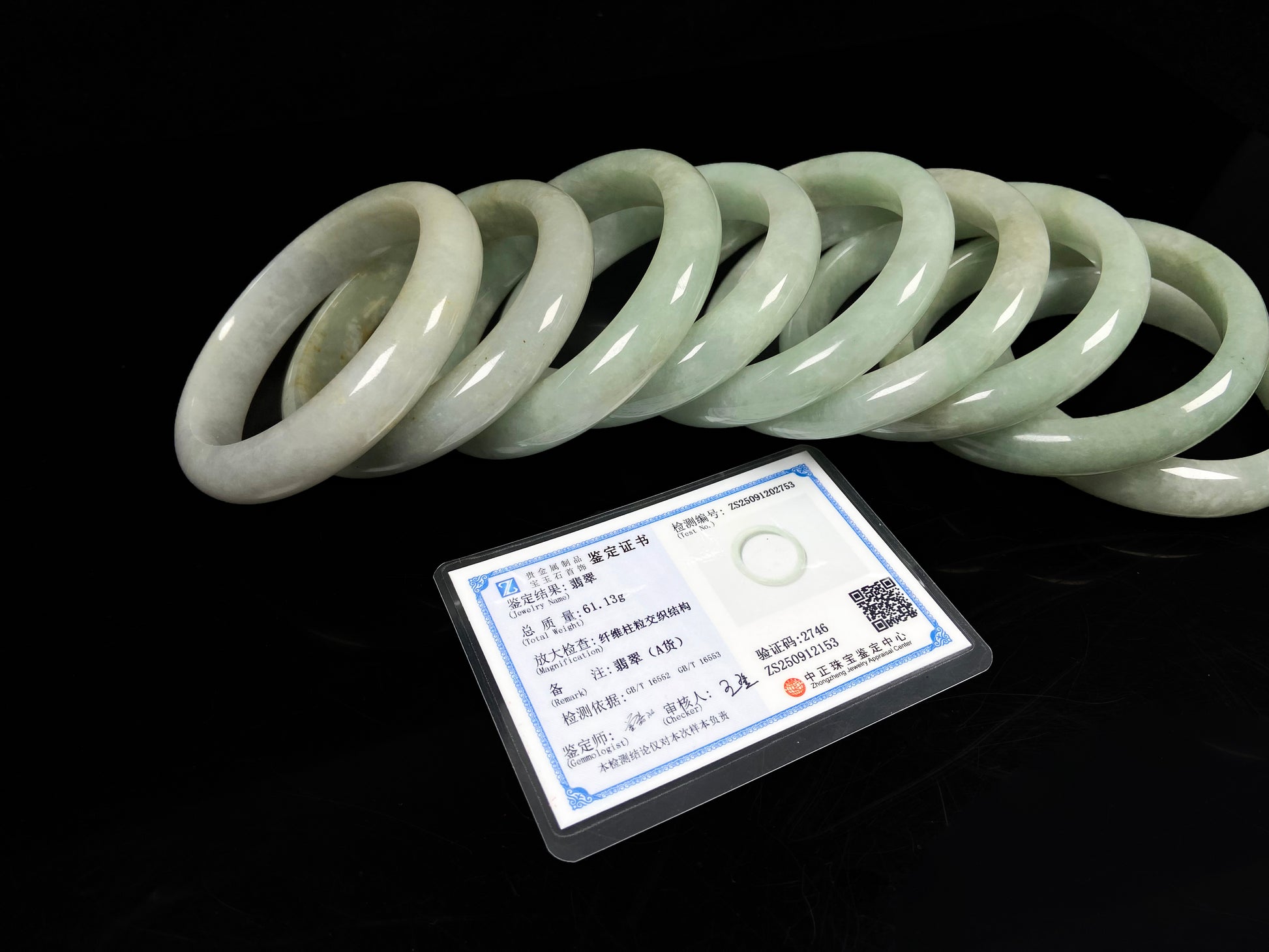 A willow bud green glow jadeite bangle group.