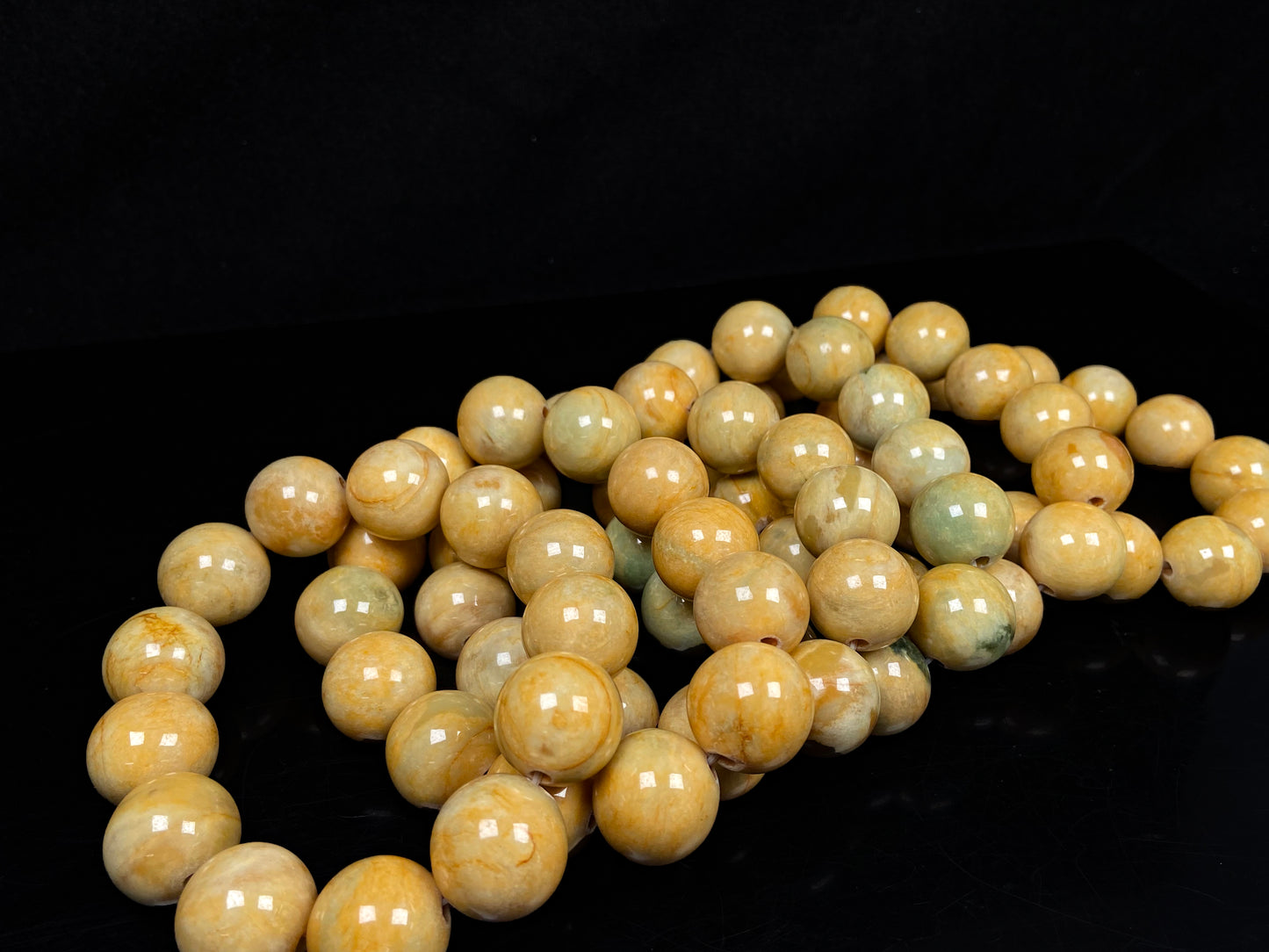 A group of warm sugar yellow jadeite beads bracelet.