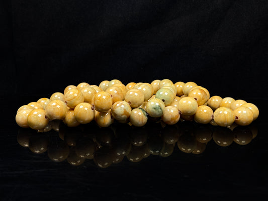 A group of warm sugar yellow jadeite beads bracelet.