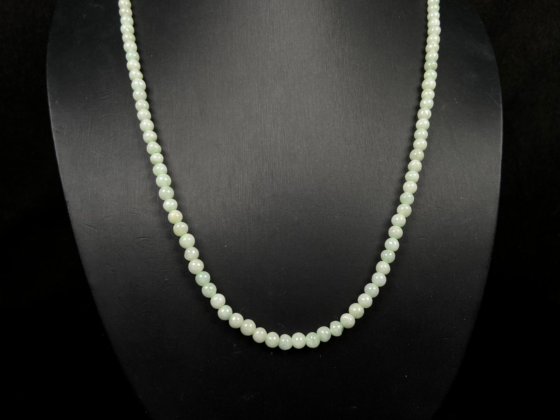 A soft milky green jadeite beads necklace.