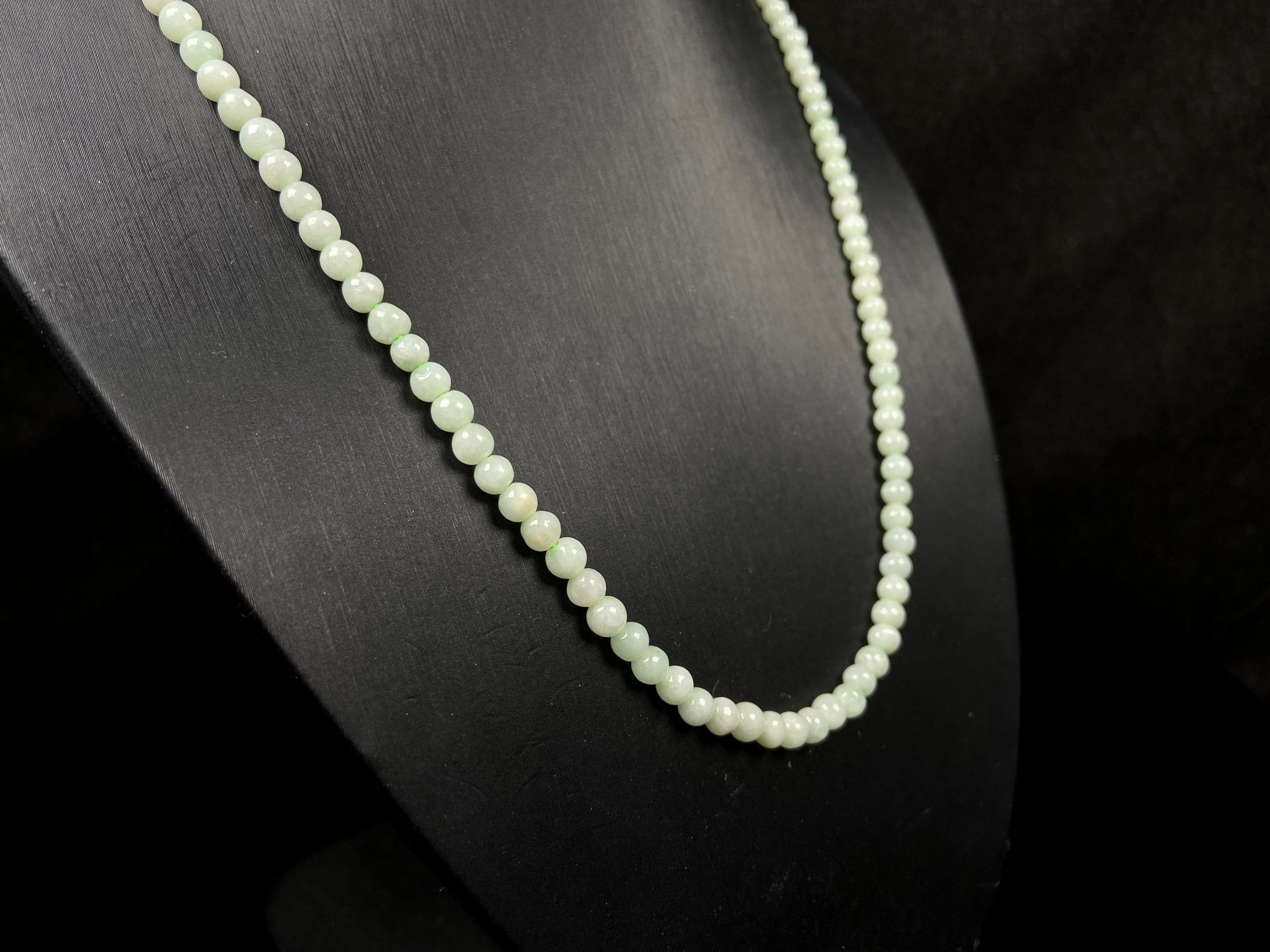 A soft milky green jadeite beads necklace.