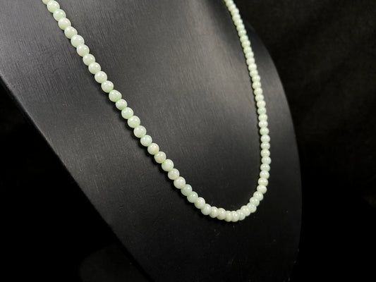 A soft milky green jadeite beads necklace.