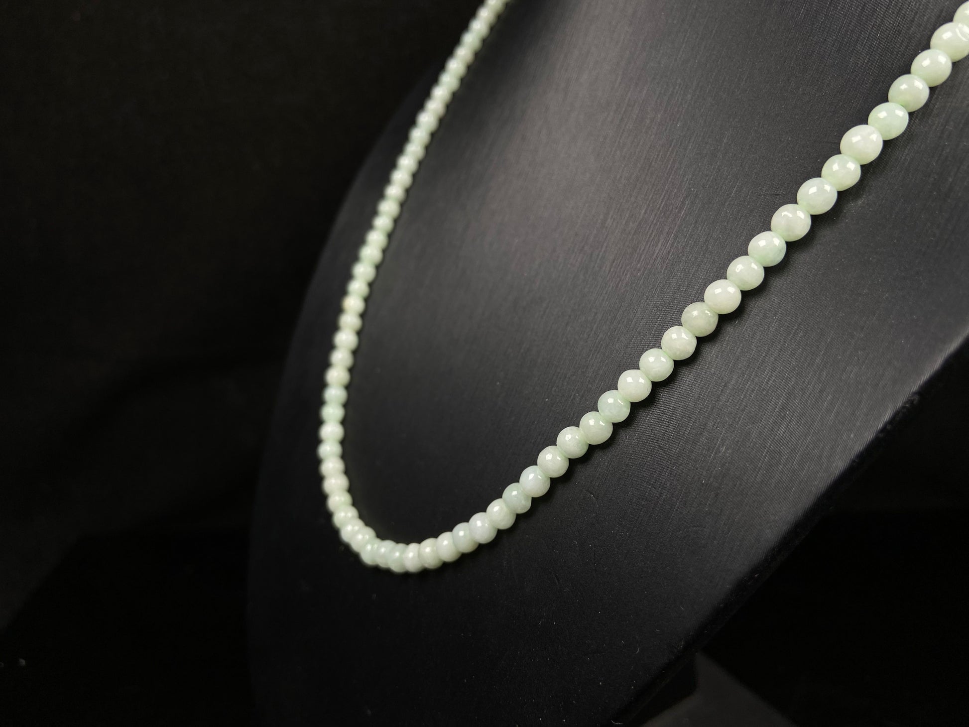 A soft milky green jadeite beads necklace.