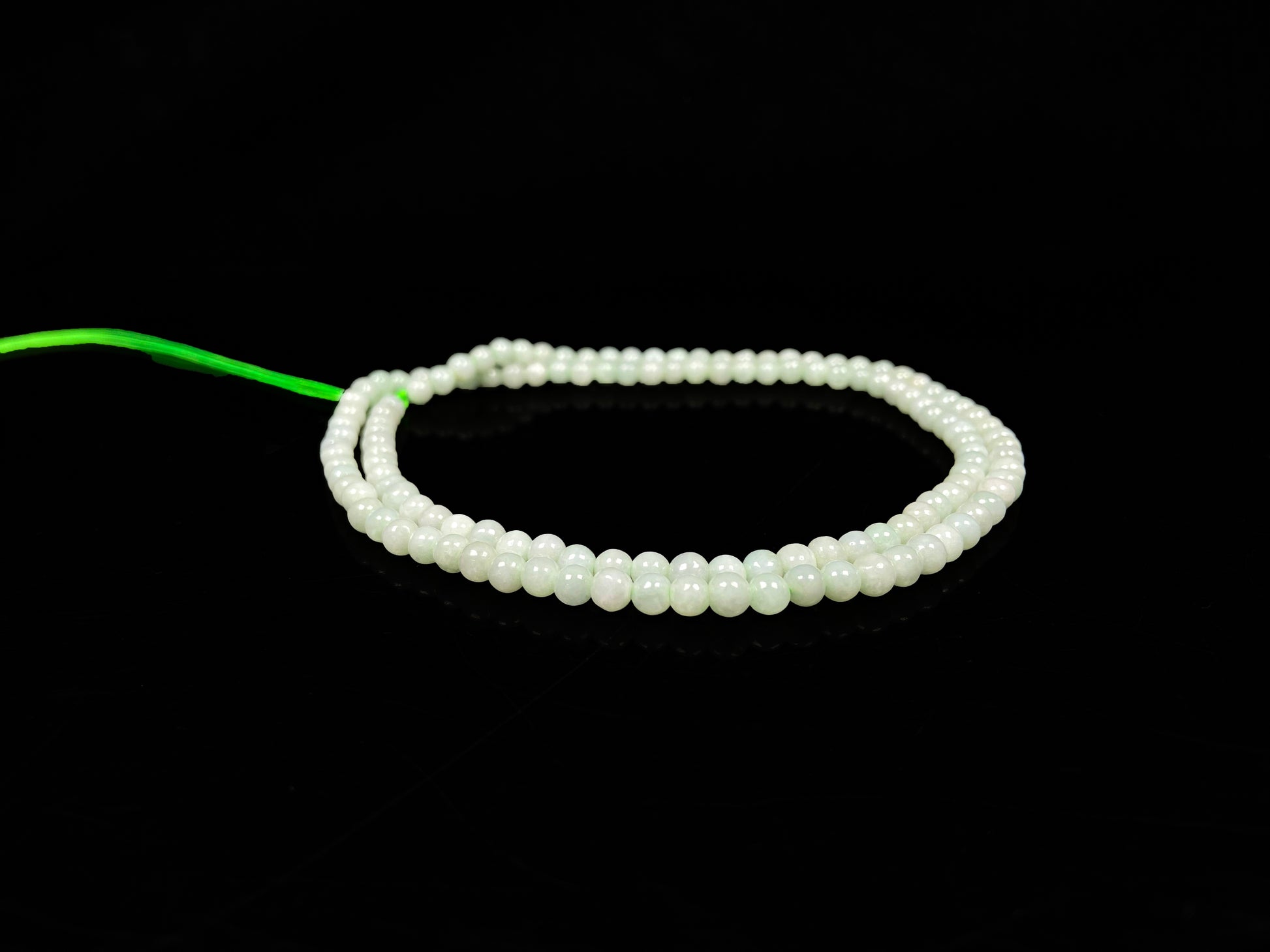 A soft milky green jadeite beads necklace.