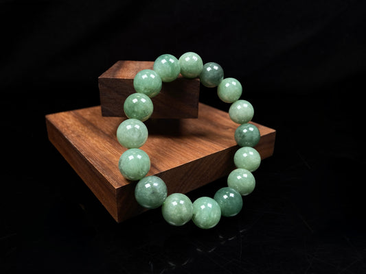 A verdant misty green jadeite beads bracelet.