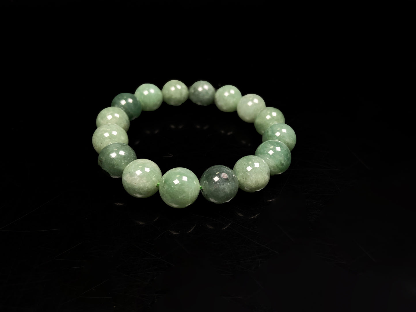 A verdant misty green jadeite beads bracelet.