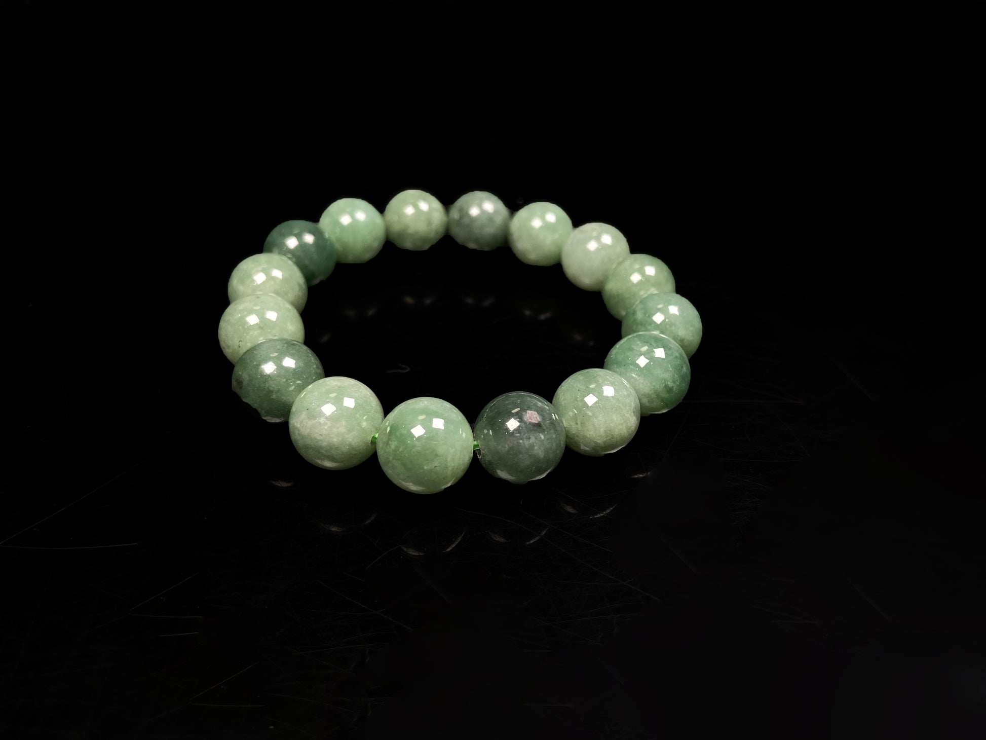 A verdant misty green jadeite beads bracelet.