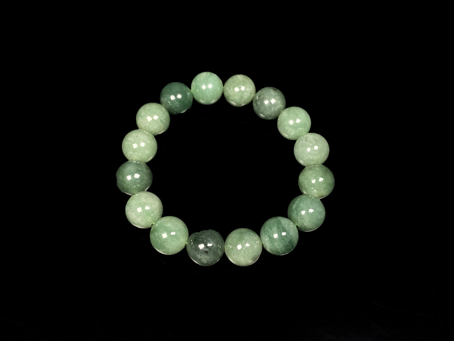 A verdant misty green jadeite beads bracelet.