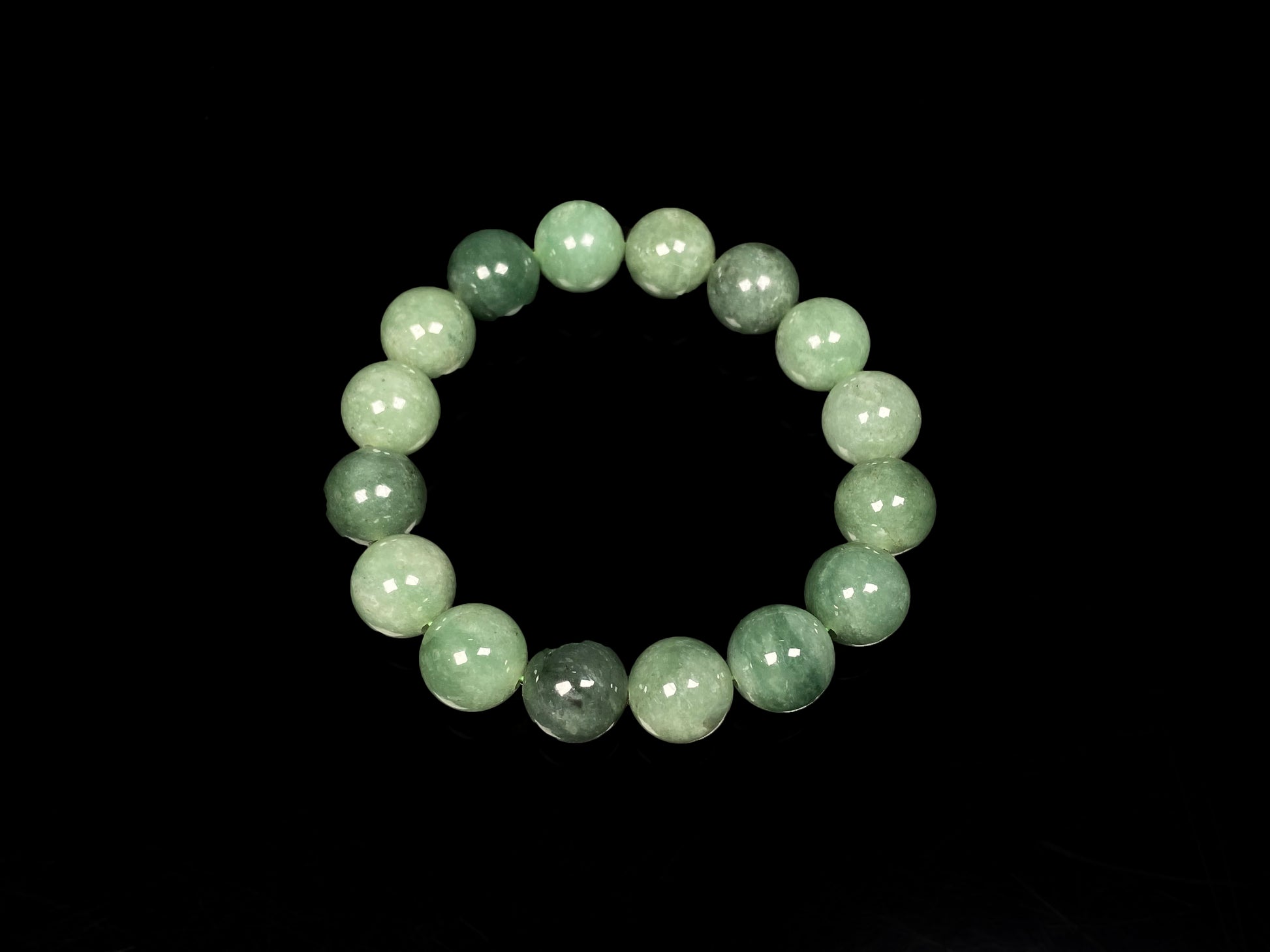 A verdant misty green jadeite beads bracelet.