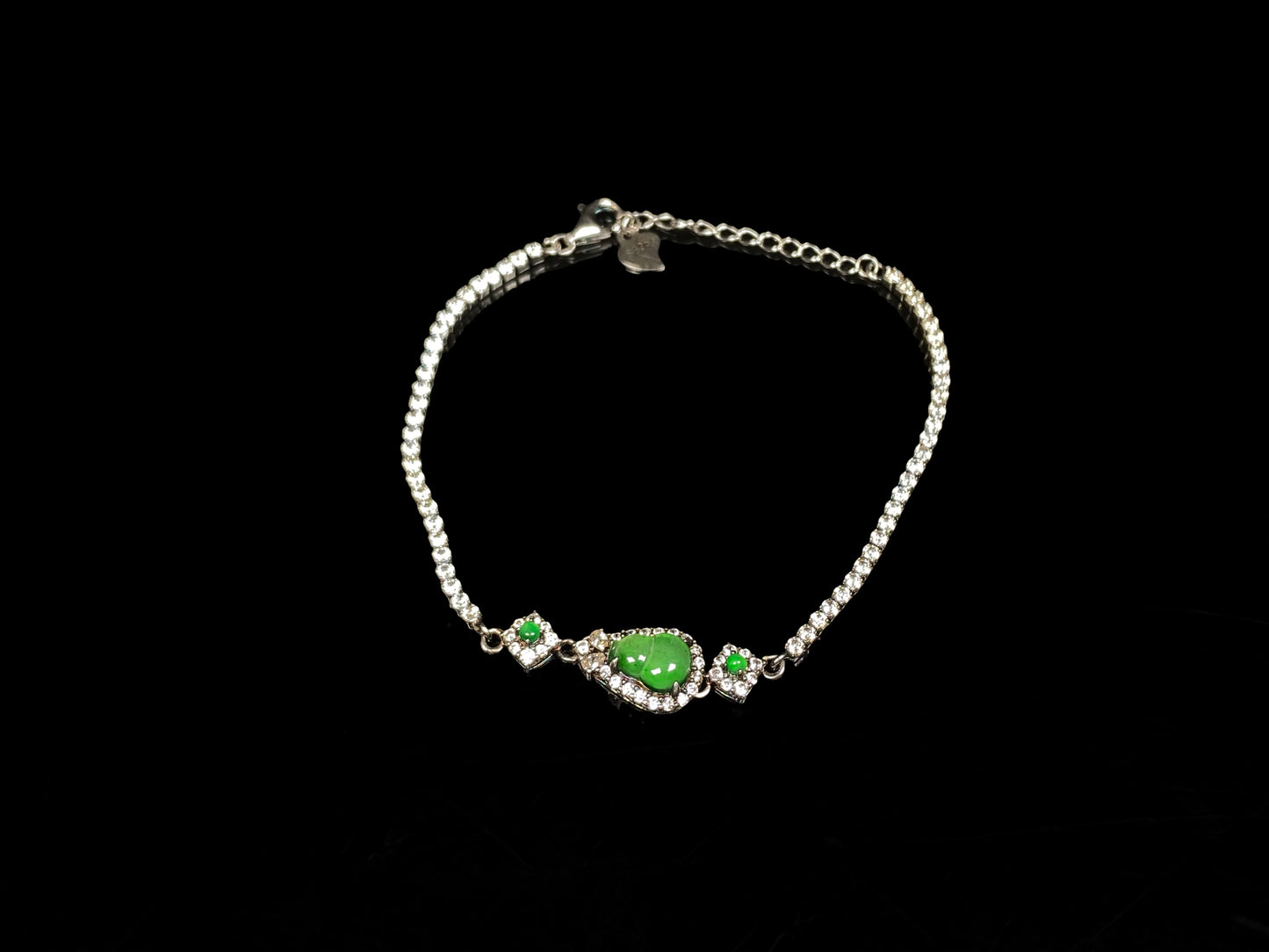 A verdant hulu fortune jadeite bracelet.