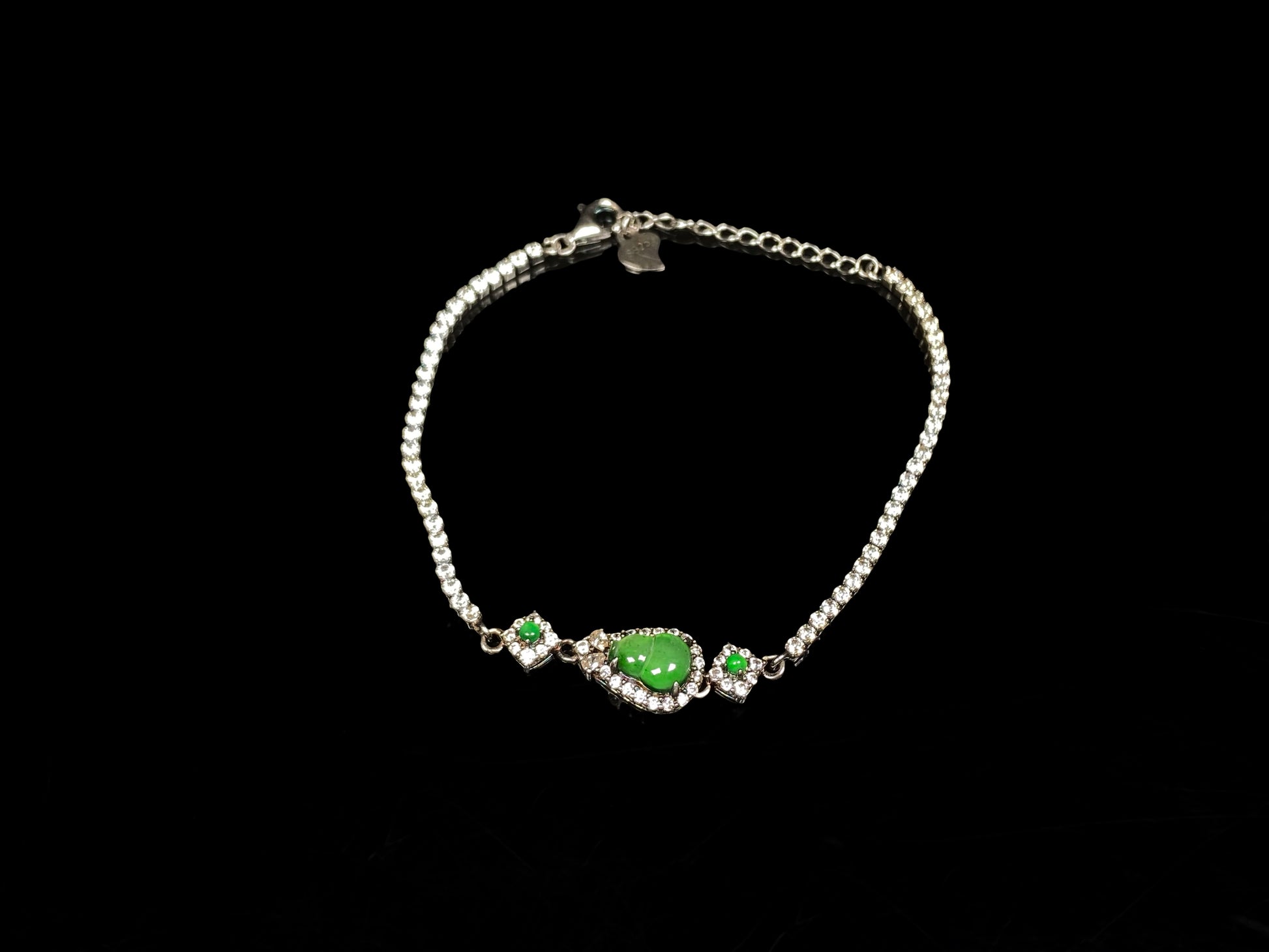 A verdant hulu fortune jadeite bracelet.
