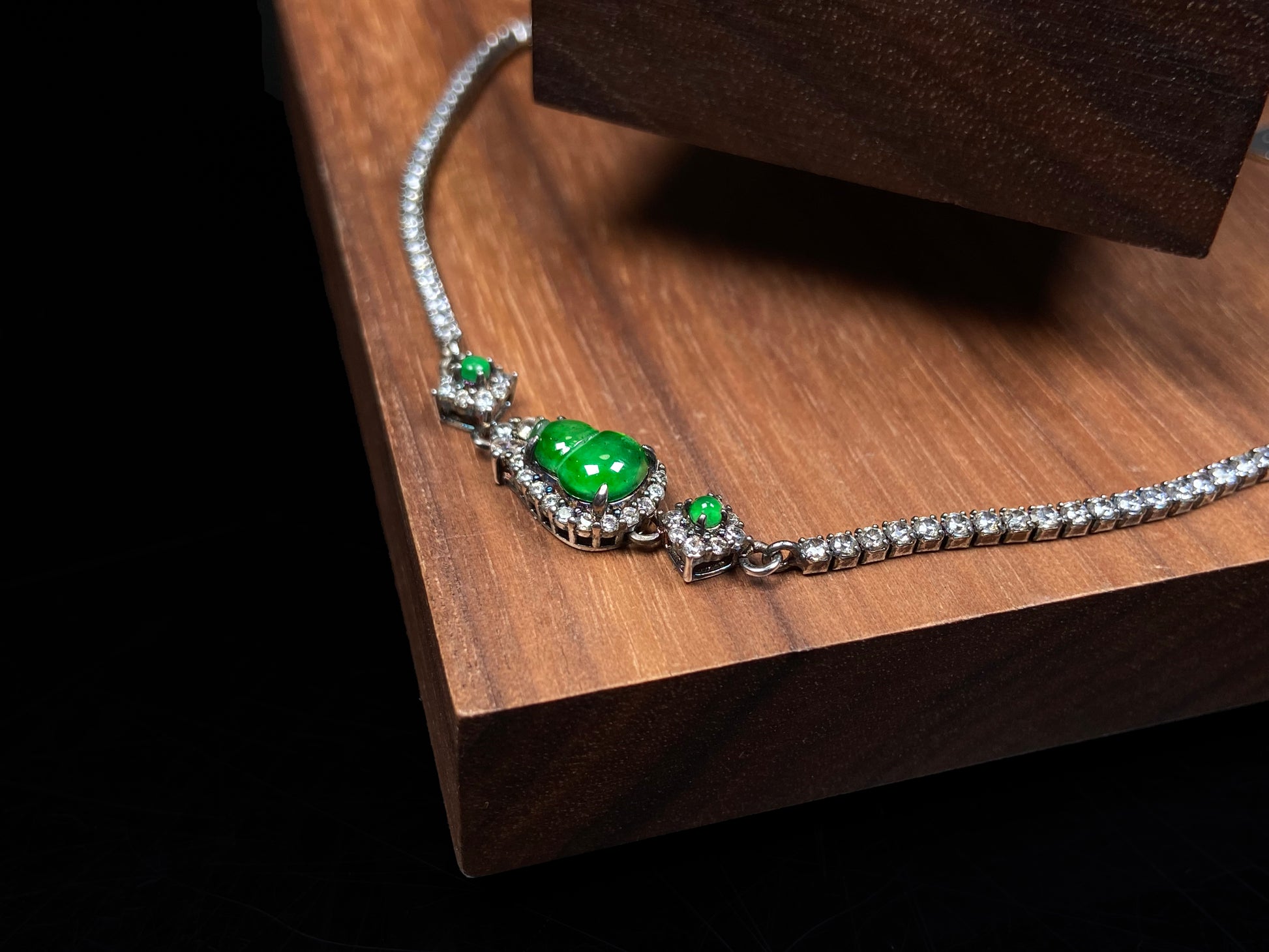 A verdant hulu fortune jadeite bracelet.