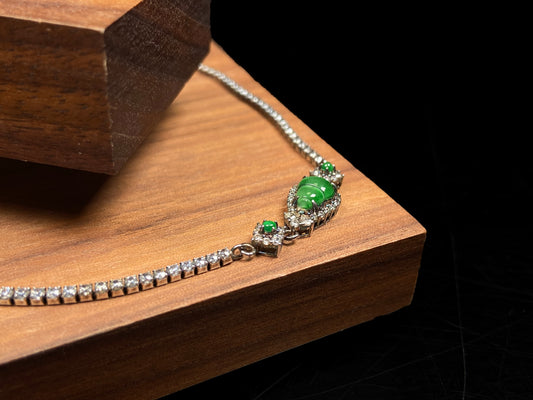 A verdant hulu fortune jadeite bracelet.