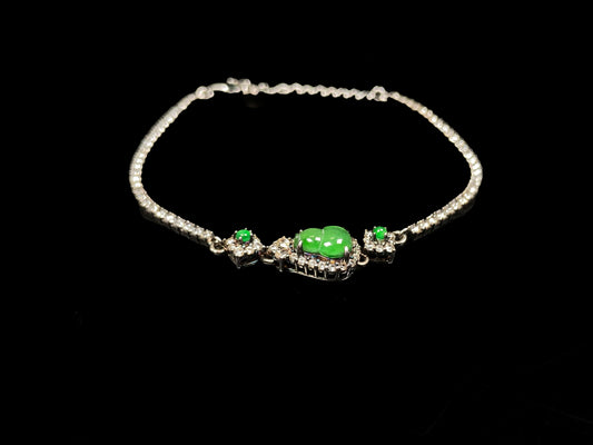 A verdant hulu fortune jadeite bracelet.