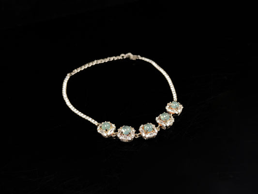 A soft green floral cluster jadeite  bracelet.