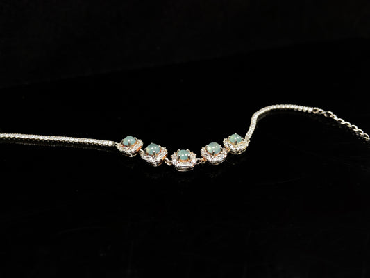 A soft green floral cluster jadeite  bracelet.