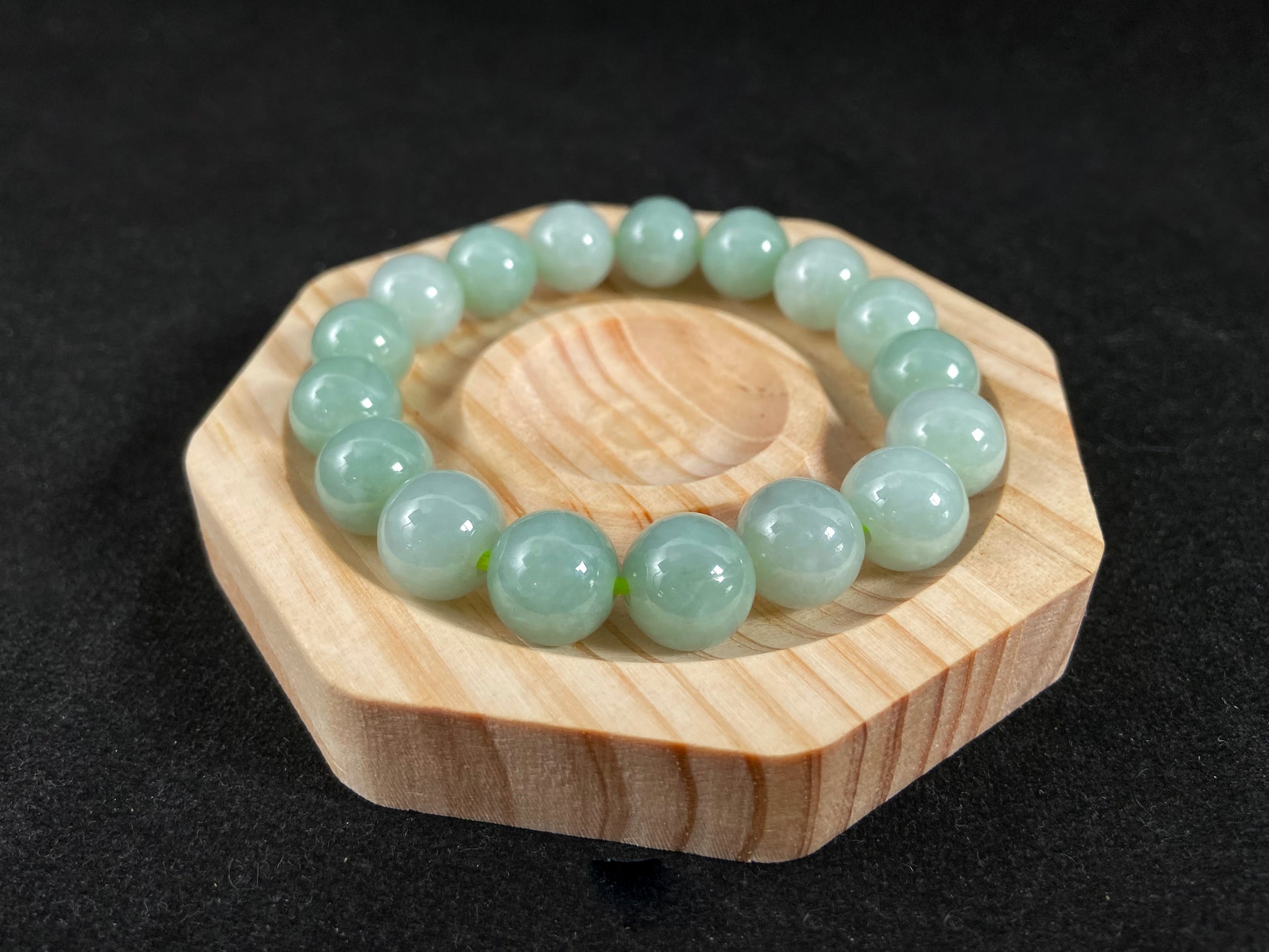 A jade bead strand in a soft green hue.