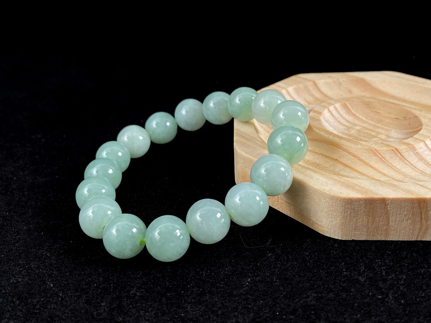 A jade bead strand in a soft green hue.