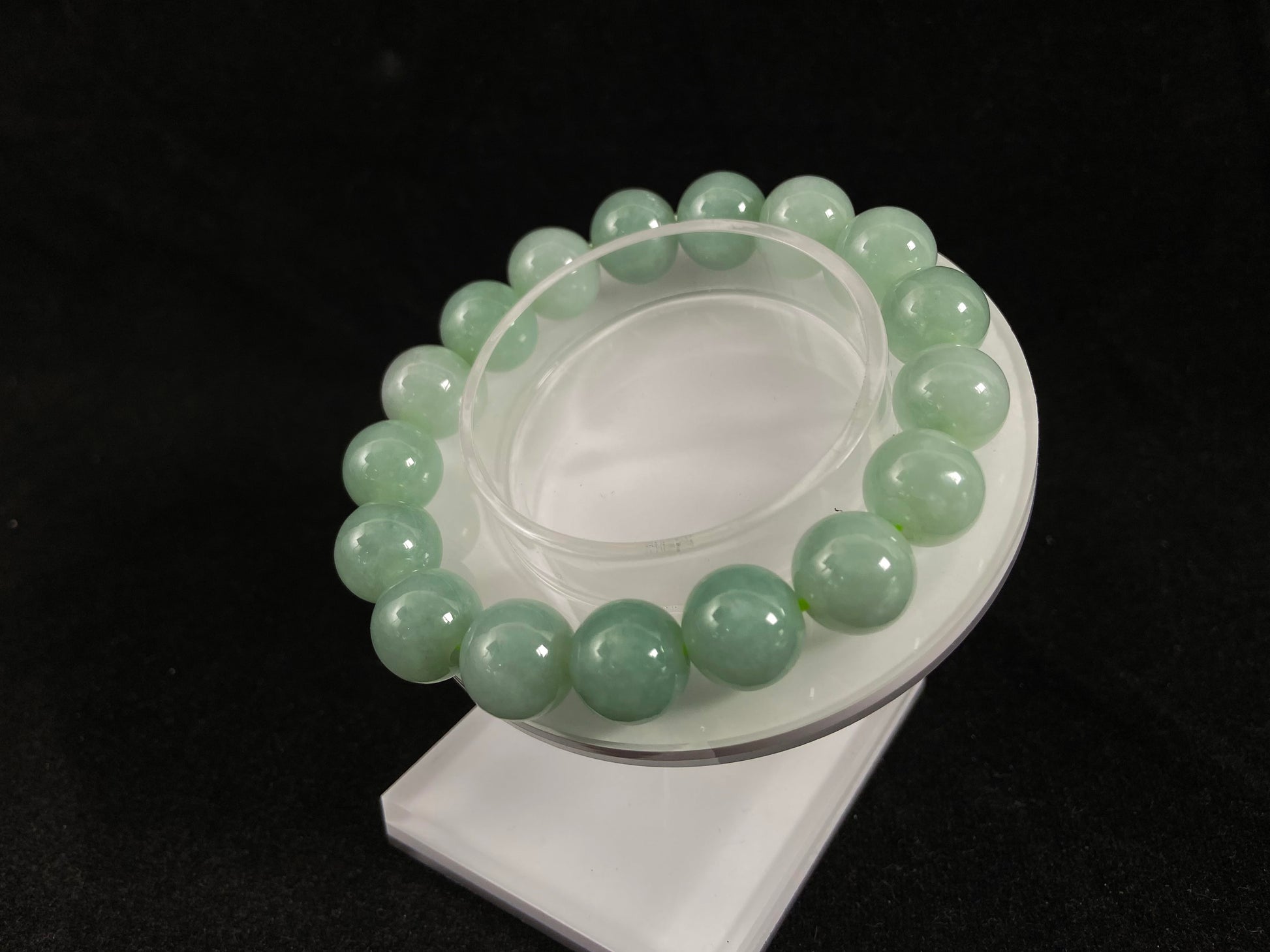 A jade bead strand in a soft green hue.