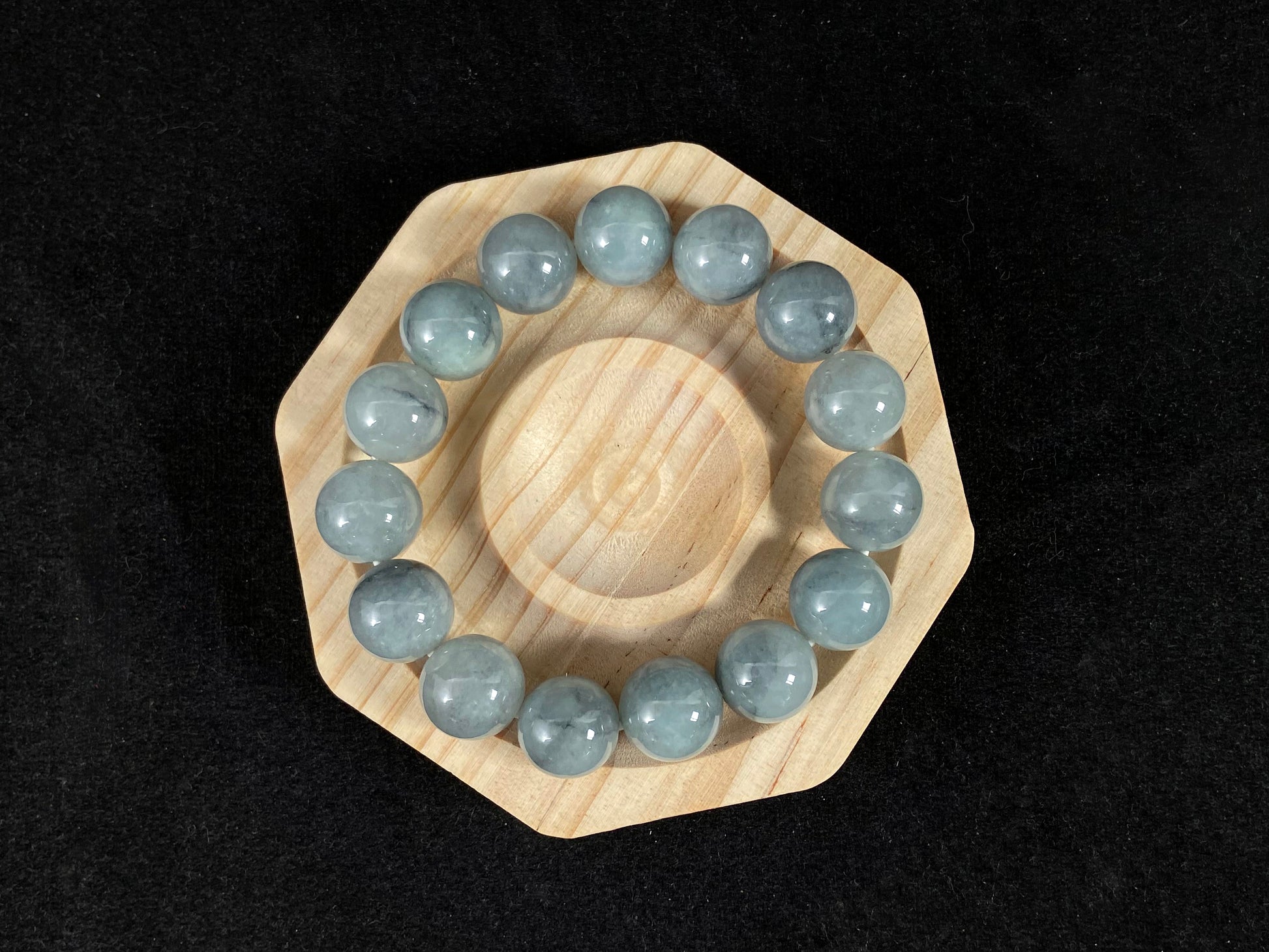 A strand of semi transparent grayish white jade beads.