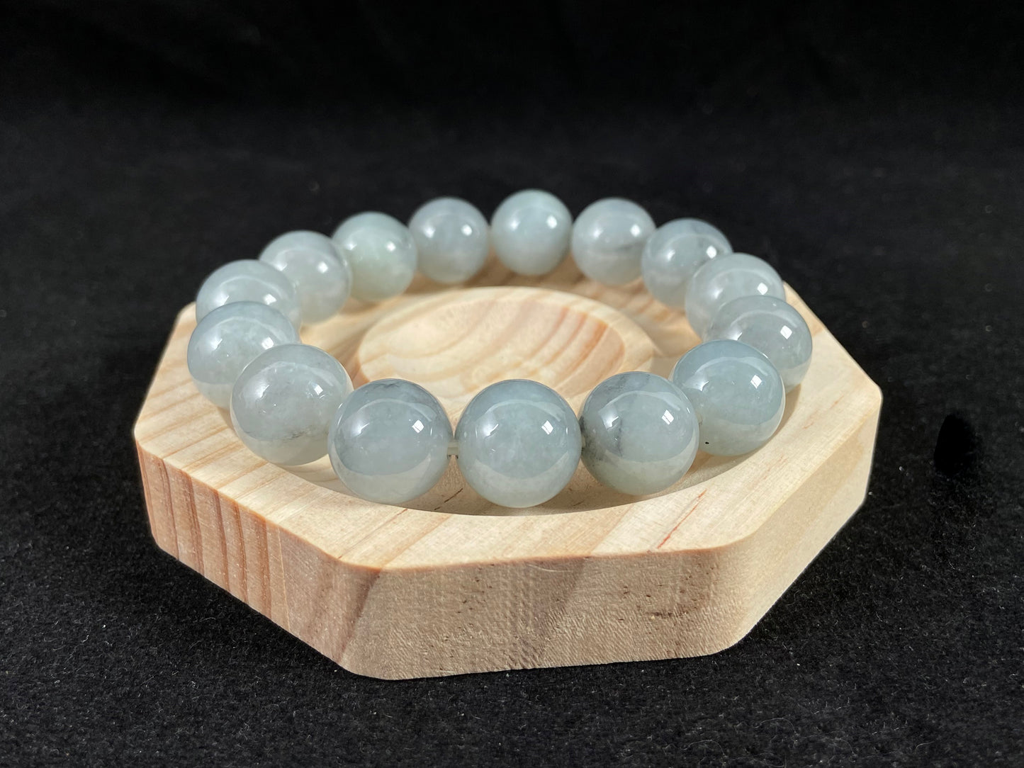 A strand of semi transparent grayish white jade beads.
