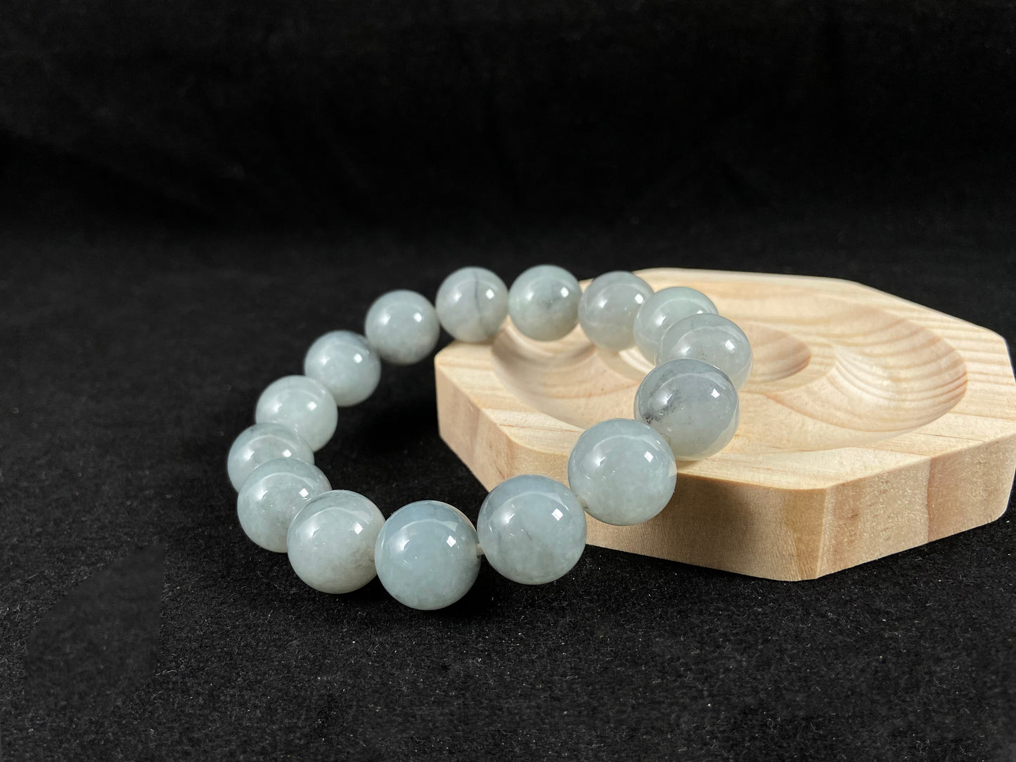 A strand of semi transparent grayish white jade beads.