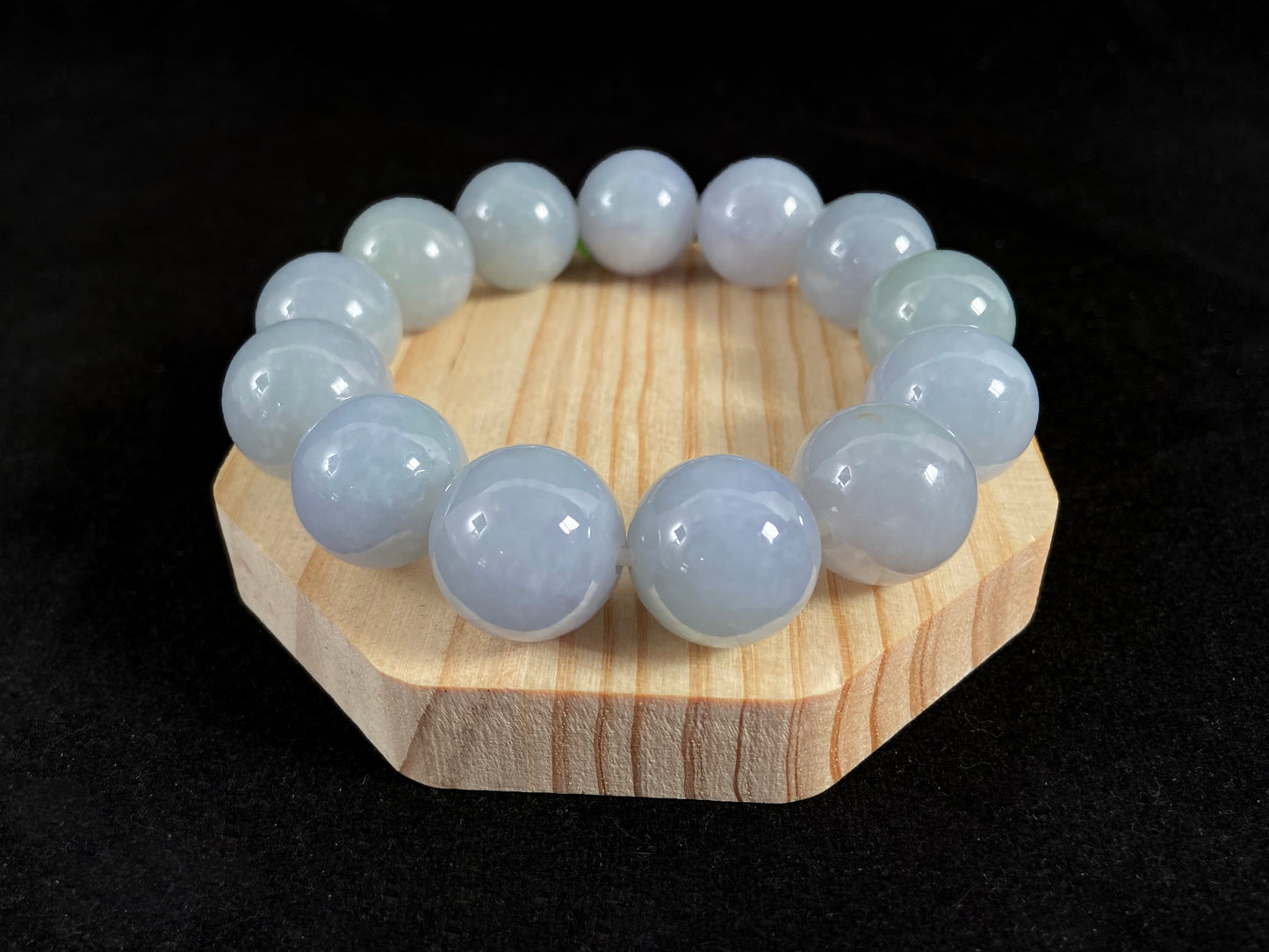 This jade bead strand showcases a natural palette of white based beads with soft lavender hues.