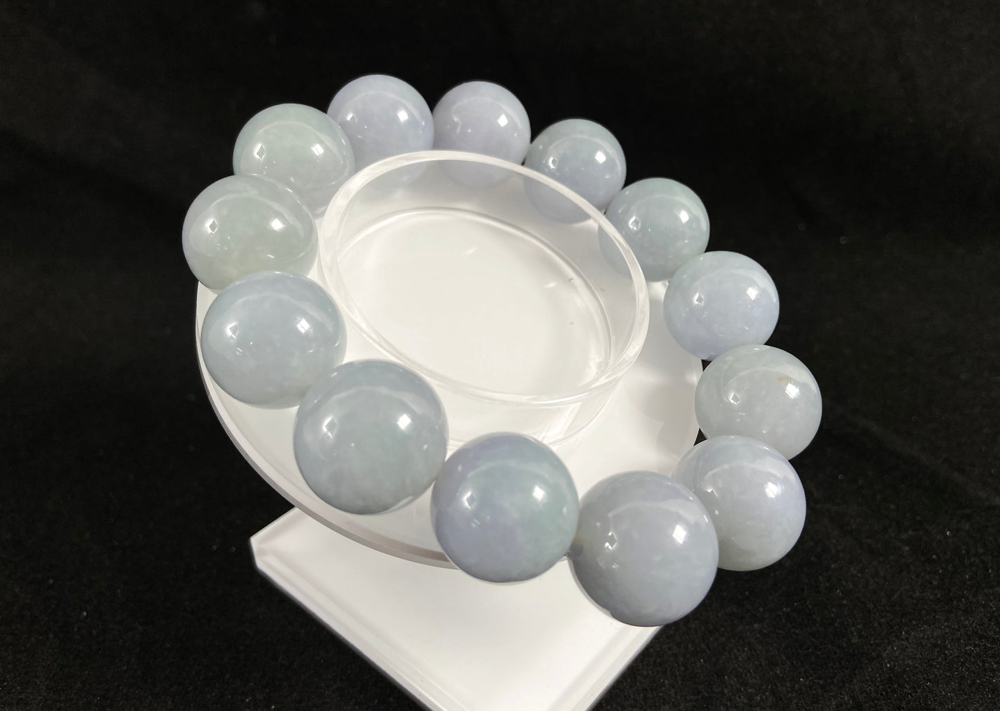 This jade bead strand showcases a natural palette of white based beads with soft lavender hues.