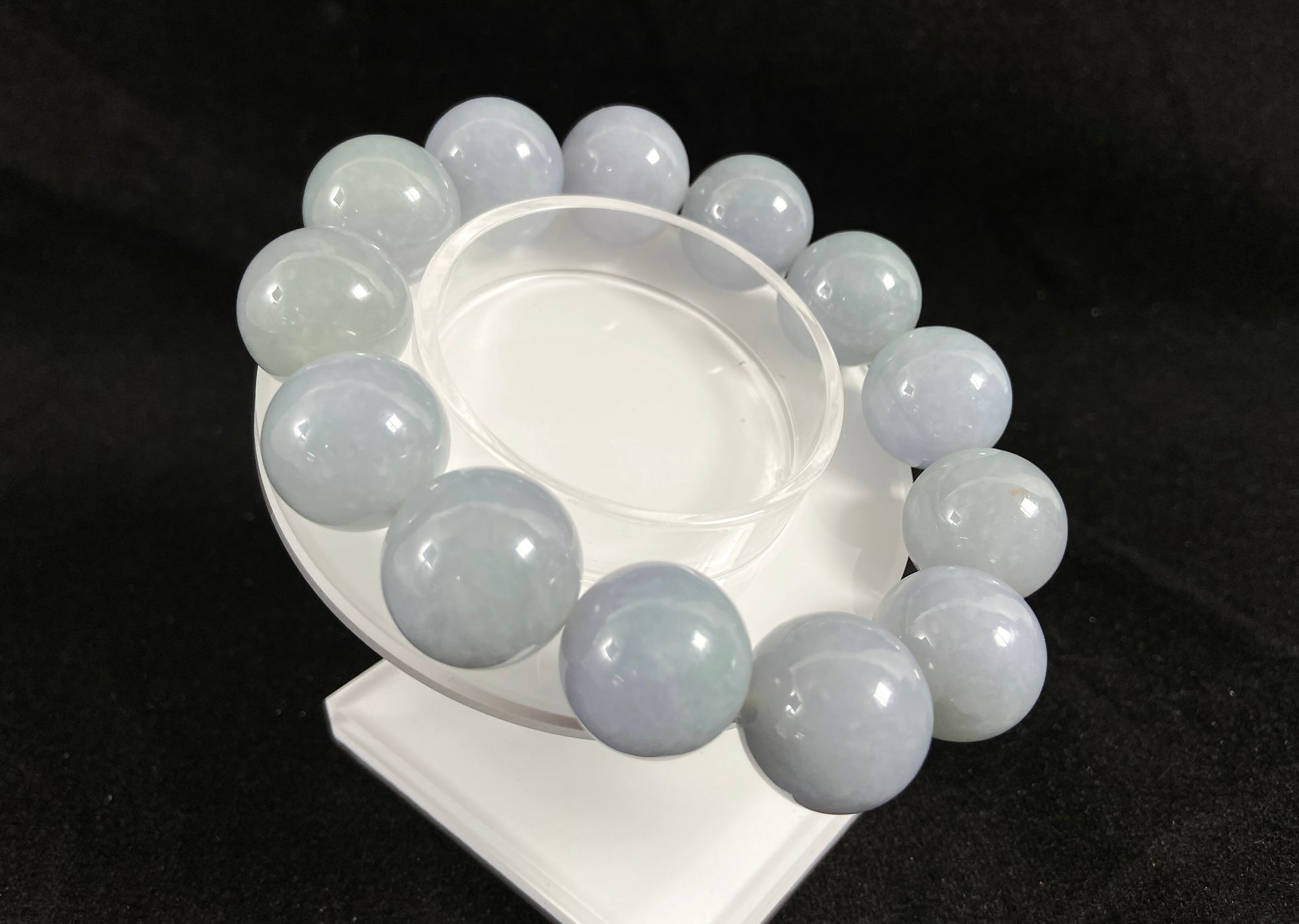 This jade bead strand showcases a natural palette of white based beads with soft lavender hues.