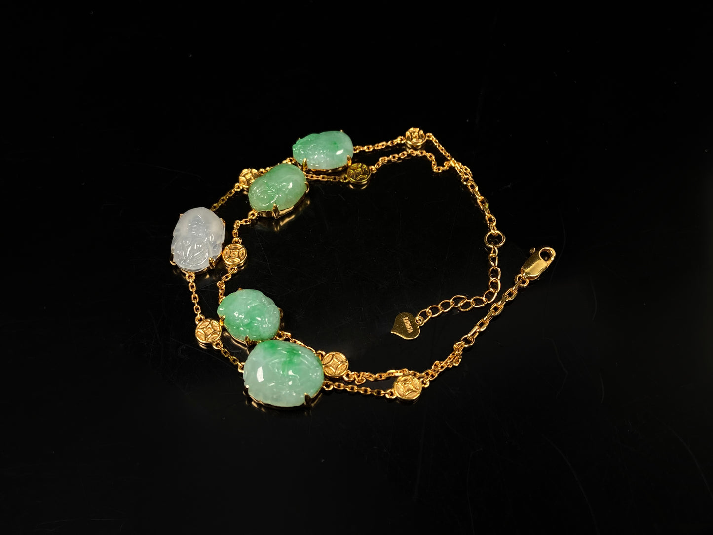 This bracelet is made with white Pixiu and green jadeite Pixiu.