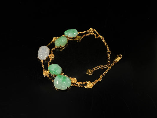 This bracelet is made with white Pixiu and green jadeite Pixiu.