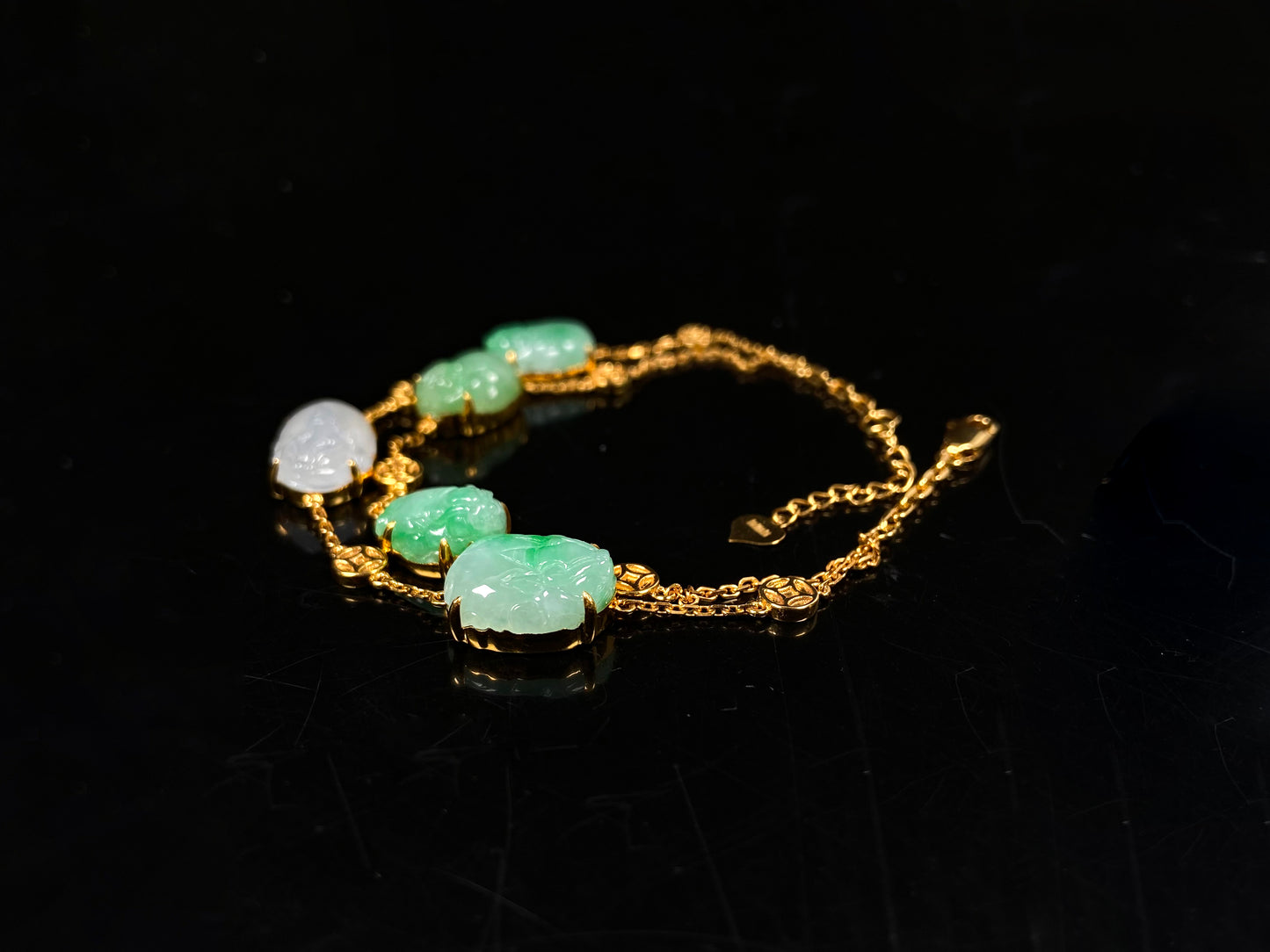 This bracelet is made with white Pixiu and green jadeite Pixiu.