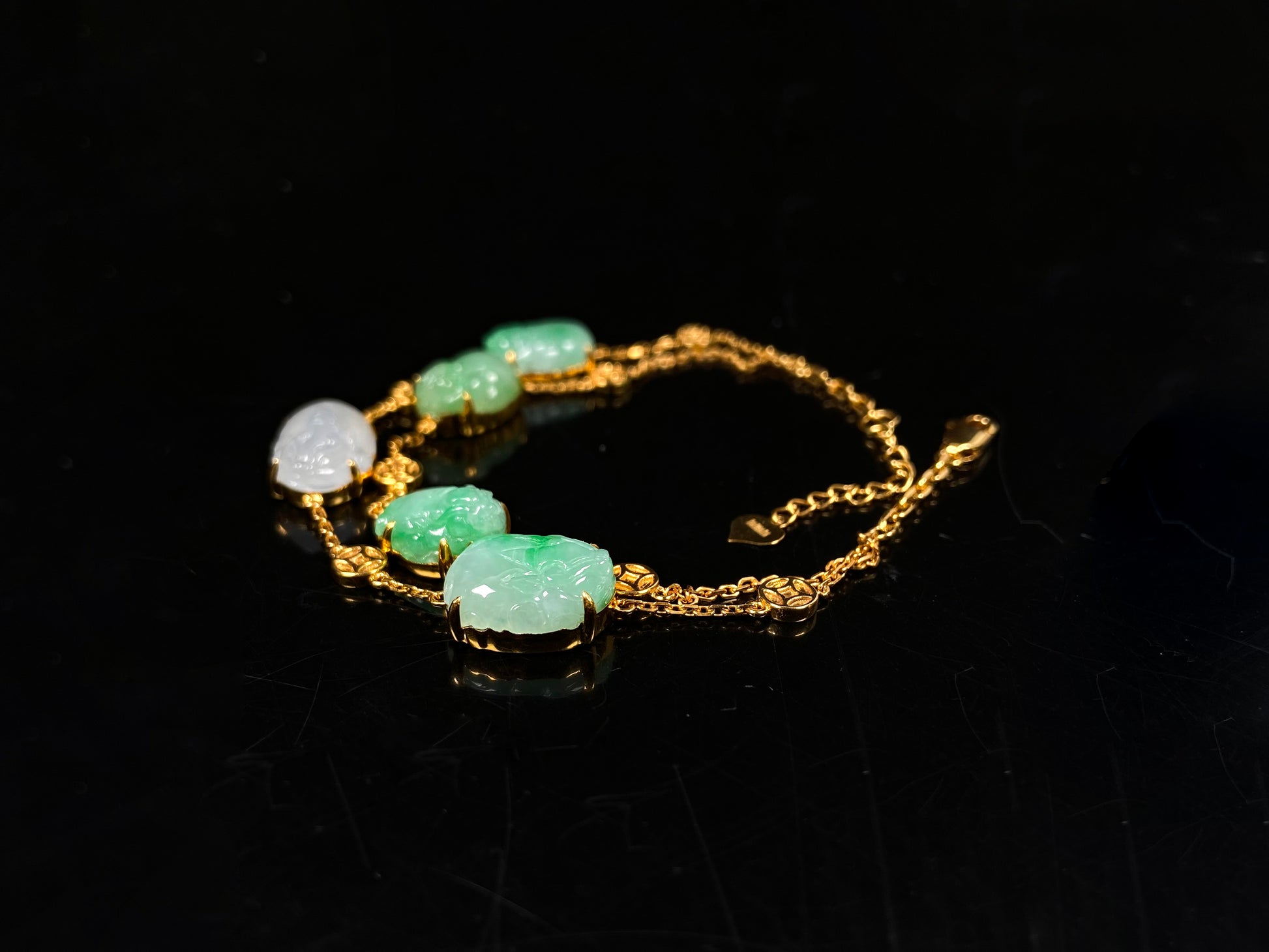 This bracelet is made with white Pixiu and green jadeite Pixiu.
