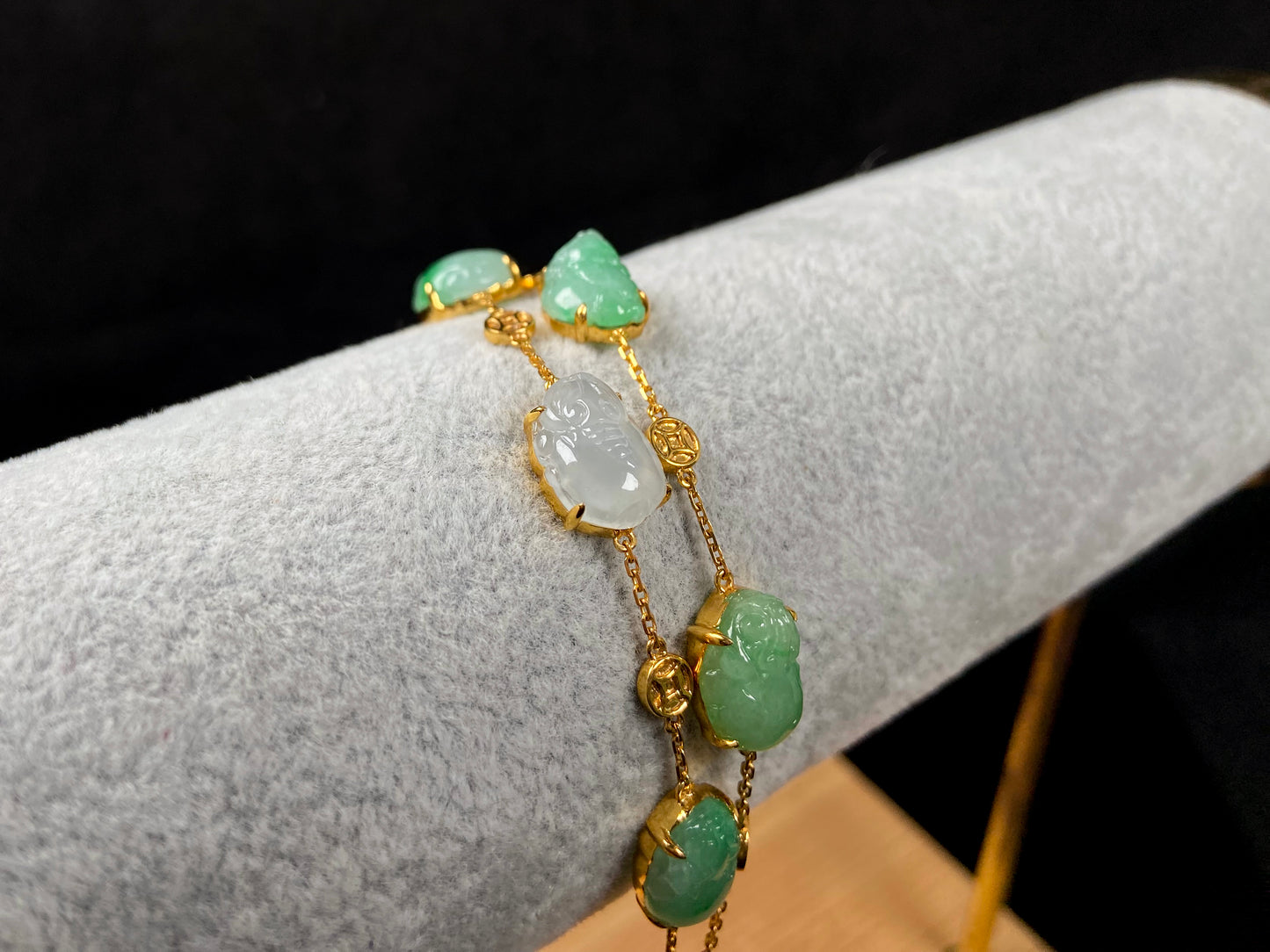 This bracelet is made with white Pixiu and green jadeite Pixiu.