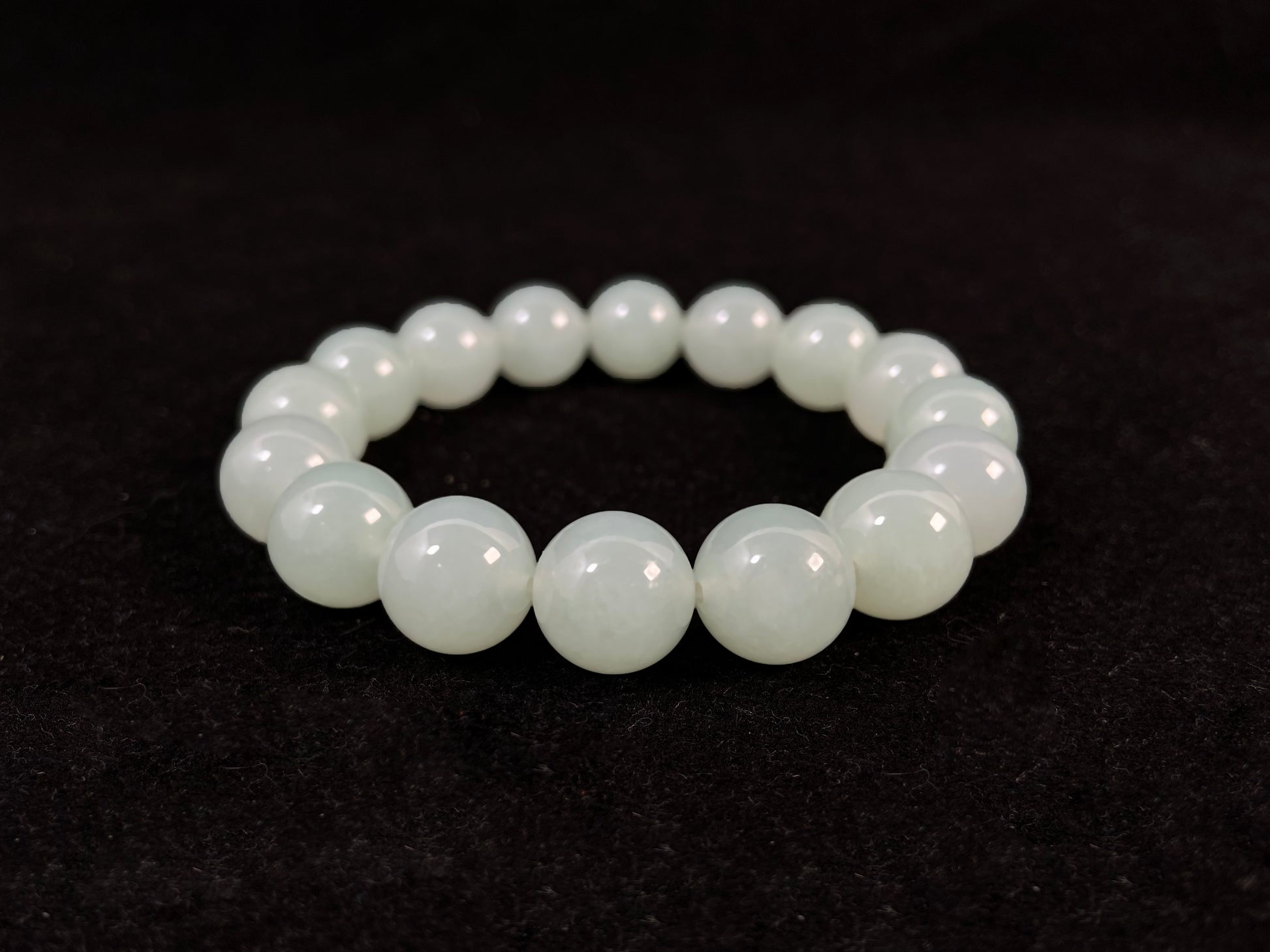 Transparent pale white green jade beads.