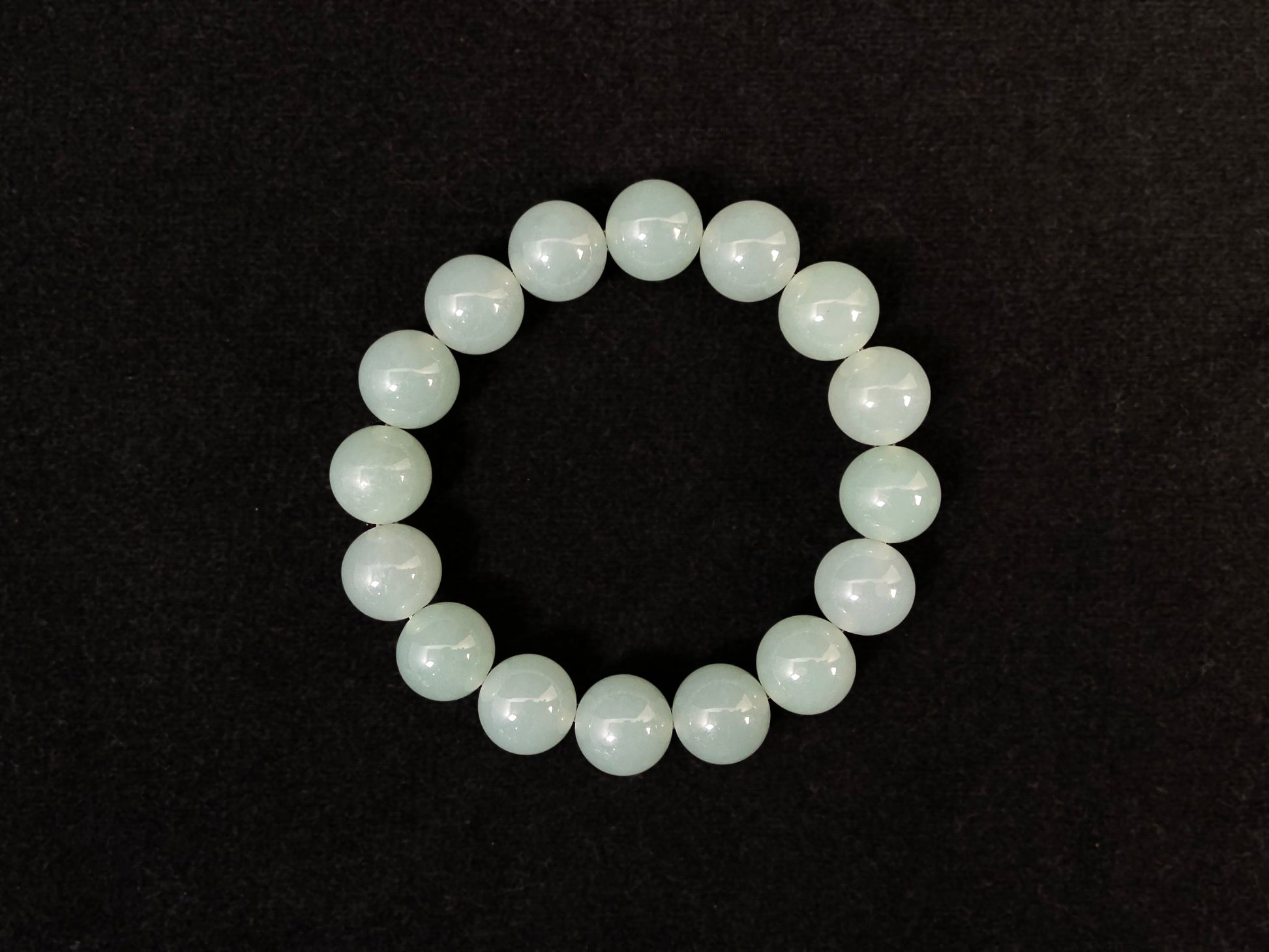 Transparent pale white green jade beads.