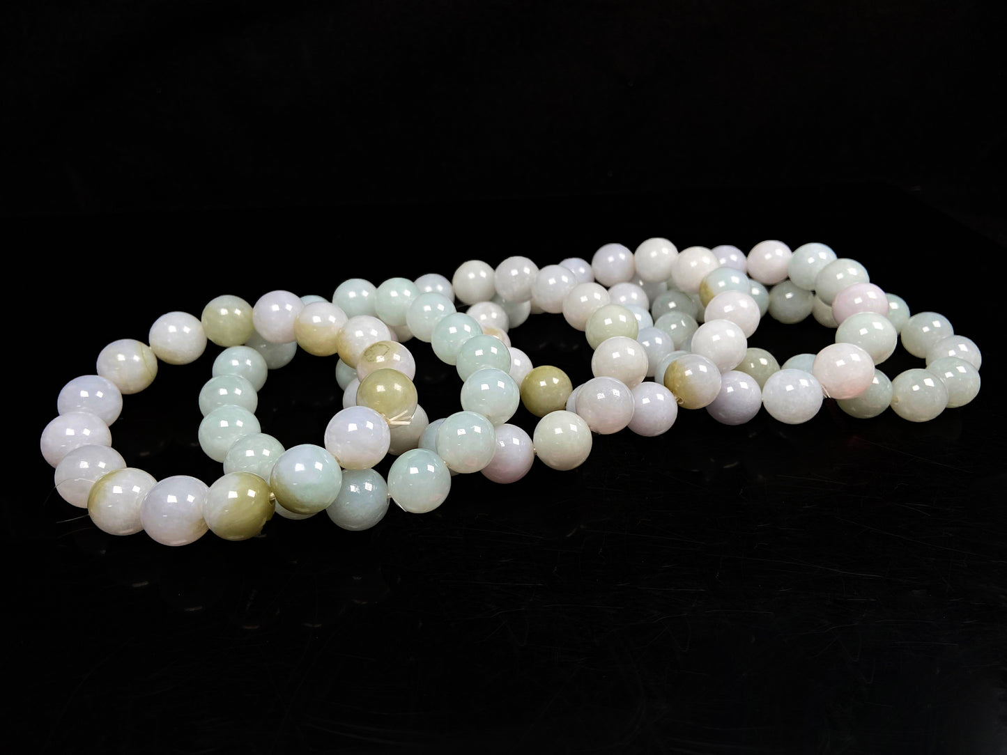 A creamy white soft green mix jadeite beads bracelet group.